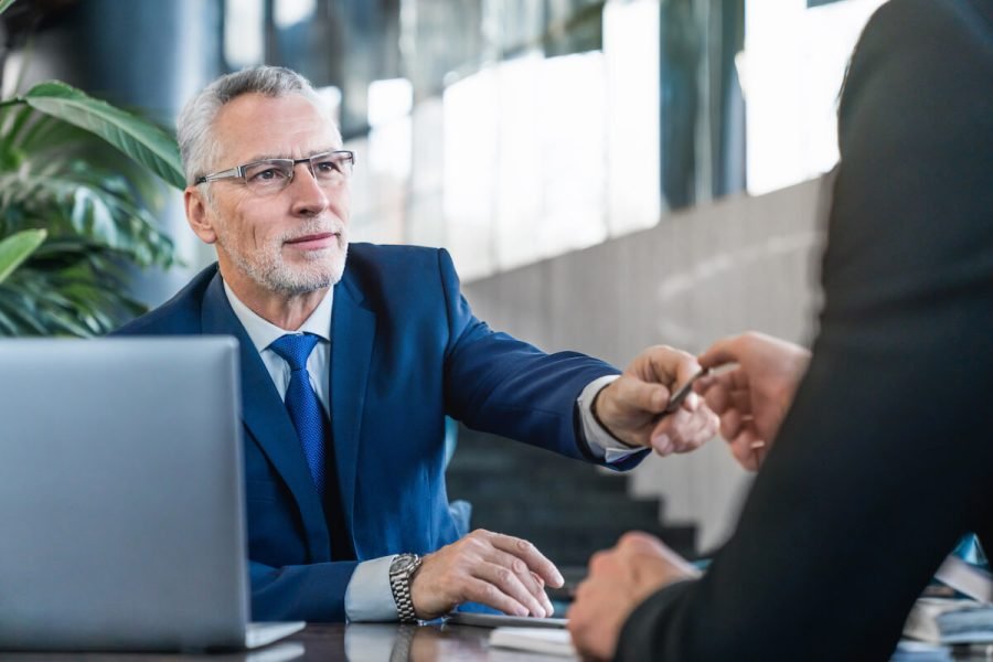 senior-and-young-businessmen-having-a-meeting-in-o-2025-01-09-05-41-56-utc_flip.jpg